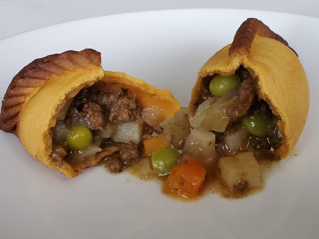 BEEF : Experience the warmth and comfort of our hearty dish with beef, potatoes, and veggies.